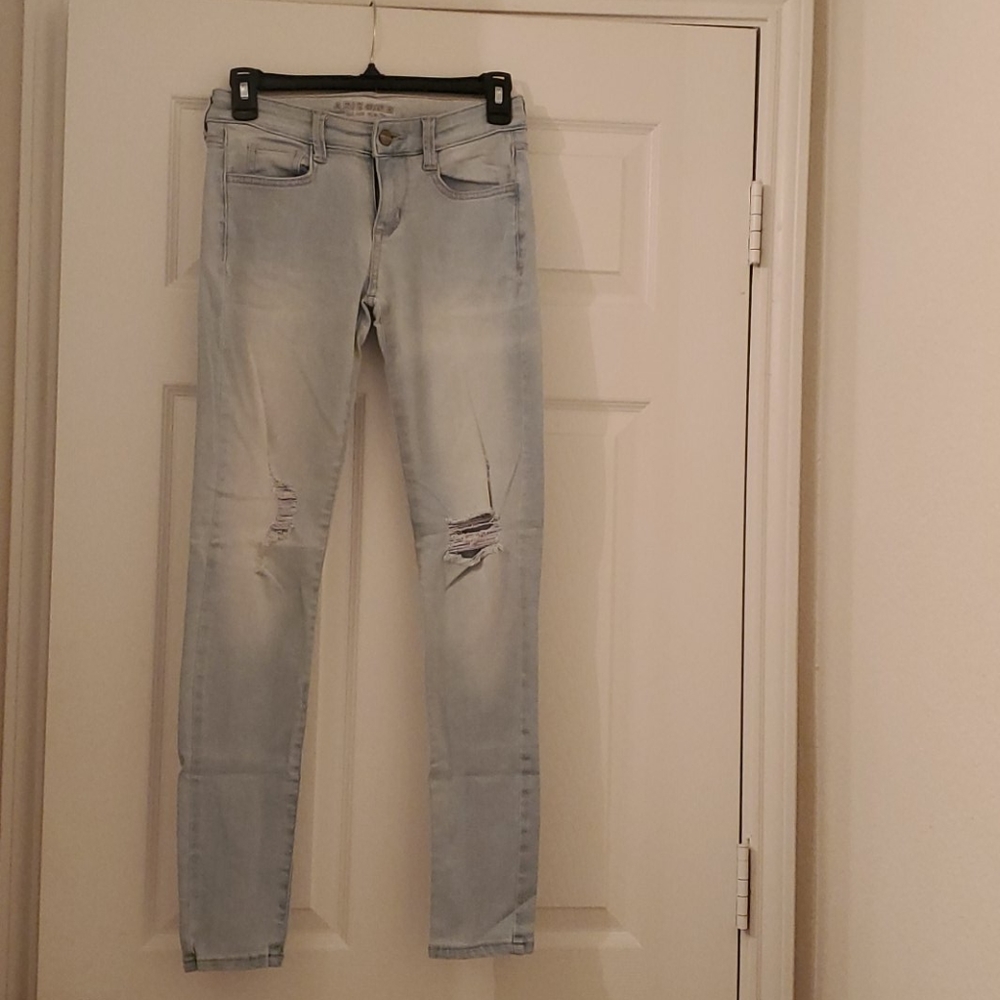 Gently used light blue jeans with ripped knees